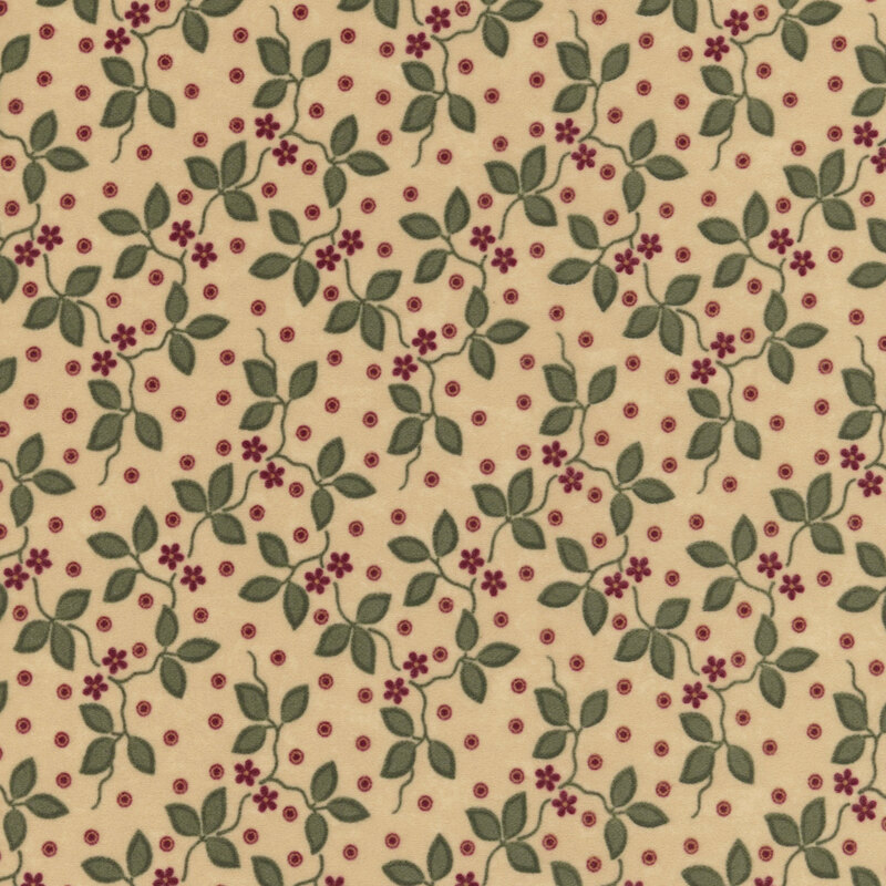 Tan flannel fabric featuring small red flowers and green vines on a dotted background.