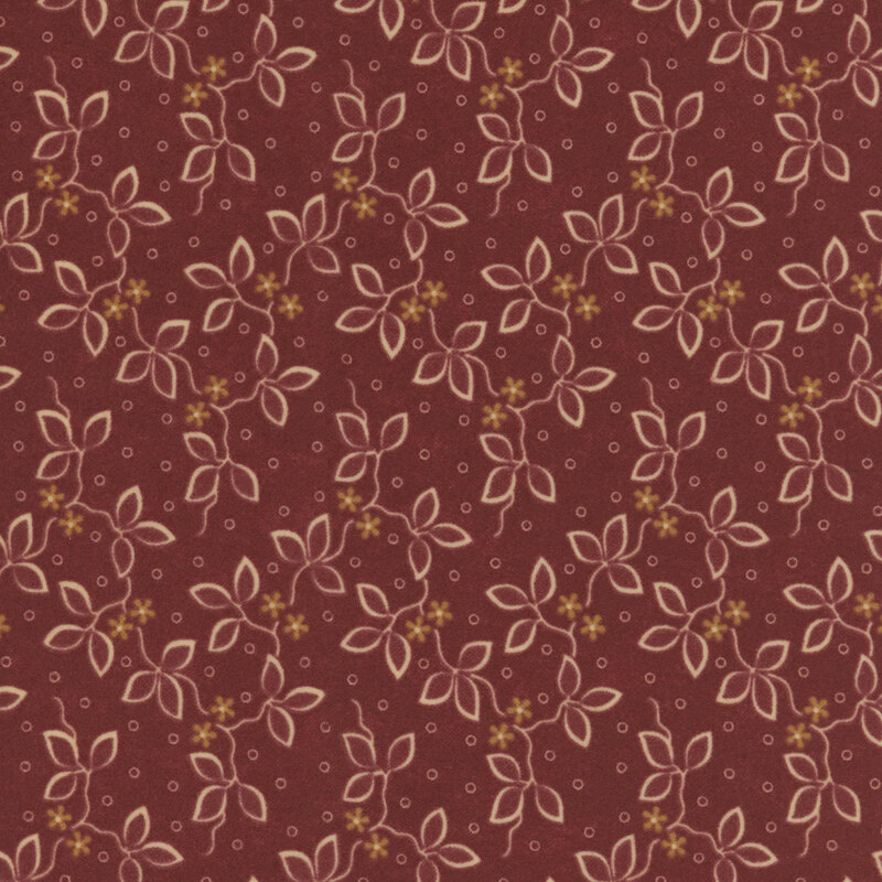 Wine red flannel fabric featuring small flowers and vines on a dotted background.