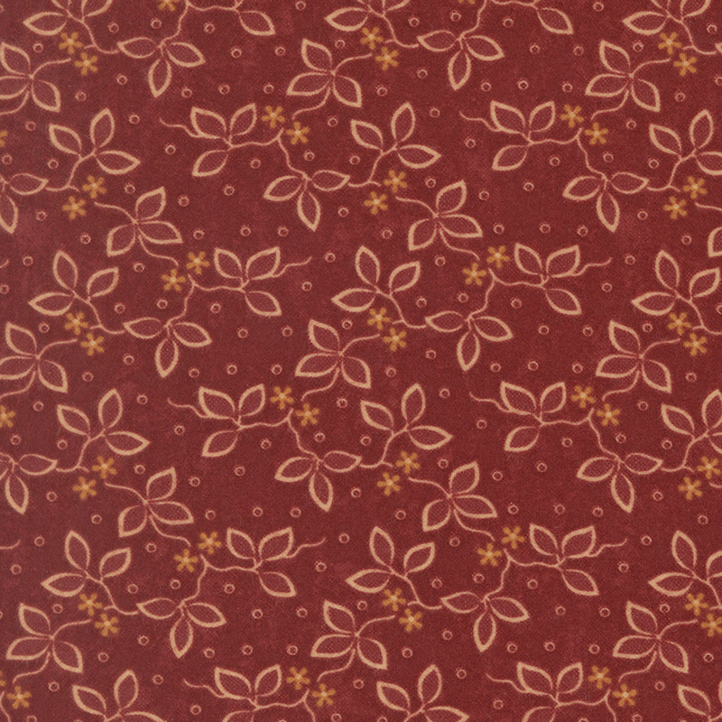 Wine red flannel fabric featuring small flowers and vines on a dotted background.