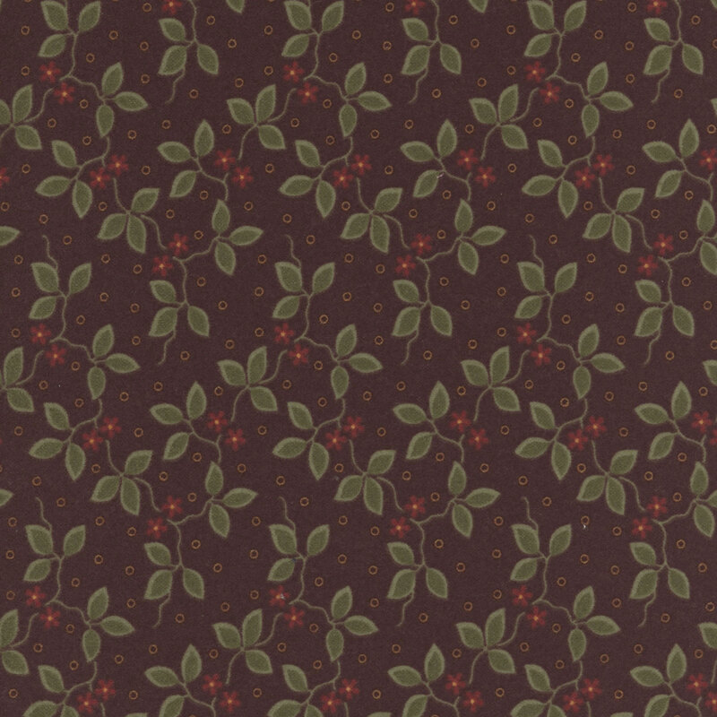Mahogany flannel fabric featuring small red flowers and green vines on a dotted background.
