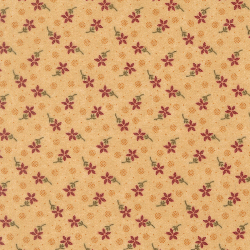Flannel fabric featuring red flowers, pin dots, and pointillism circles tossed on a tan background.