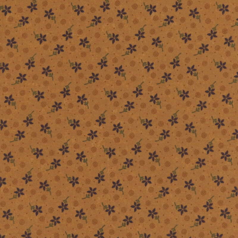 Flannel fabric featuring red flowers, pin dots, and pointillism circles tossed on a dark orange background.