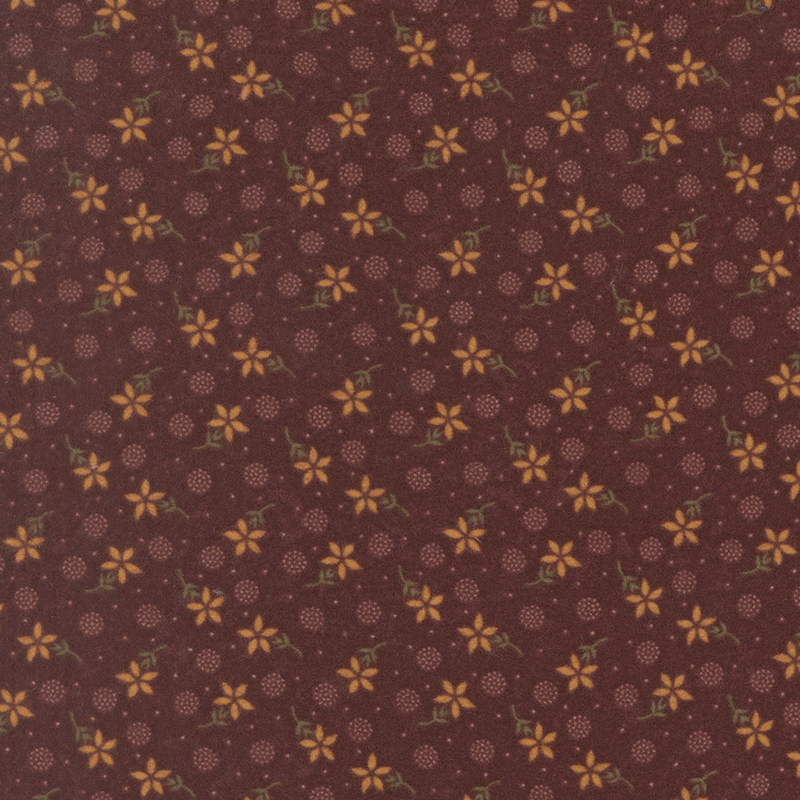 Flannel fabric featuring tan flowers, pin dots, and pointillism circles tossed on a mahogany background.