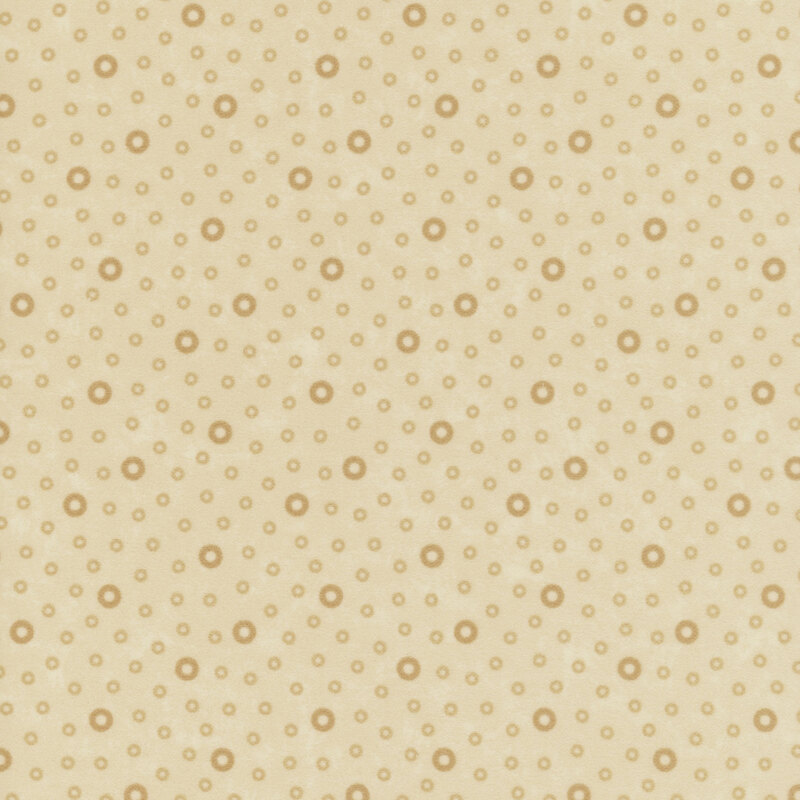 Flannel fabric tossed with tonal tan rings.