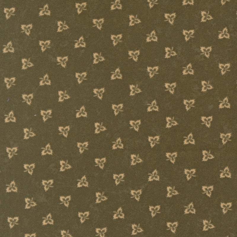 Maple leaf outlines tossed on dark olive green flannel fabric.