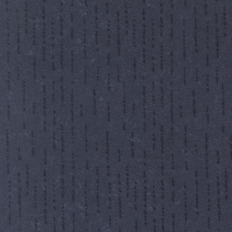 Tonal navy blue flannel fabric with dashed and dotted lines.