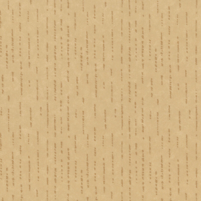Tonal tan flannel fabric with dashed and dotted lines.