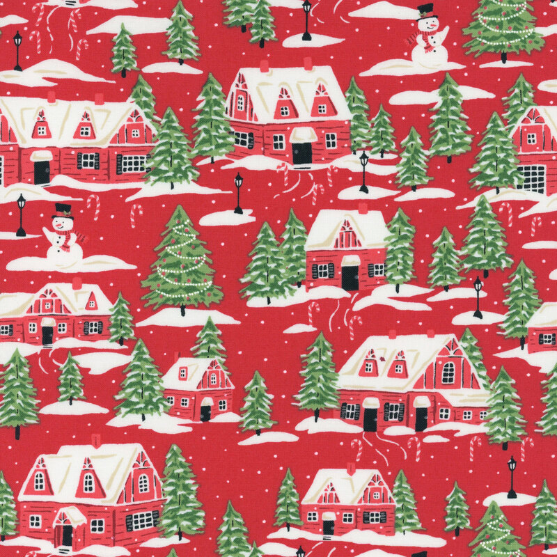 Bright red fabric featuring red cottages, evergreen trees, and snowmen dusted with snow and decorated with candy canes.