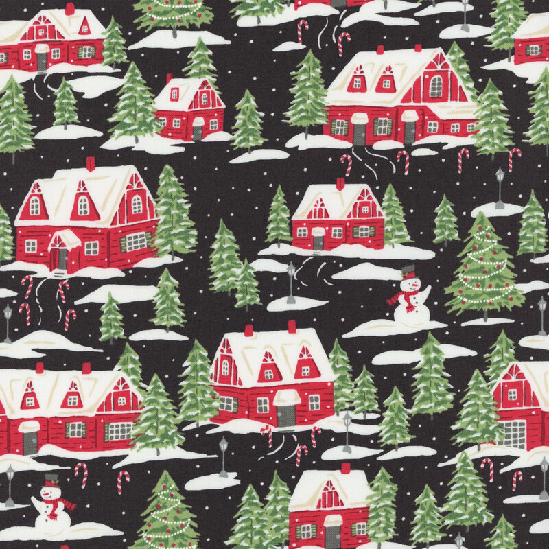 Black fabric featuring red cottages, evergreen trees, and snowmen dusted with snow and decorated with candy canes.