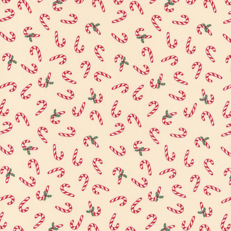 Red and white striped candy canes and holly tossed on a tan background.
