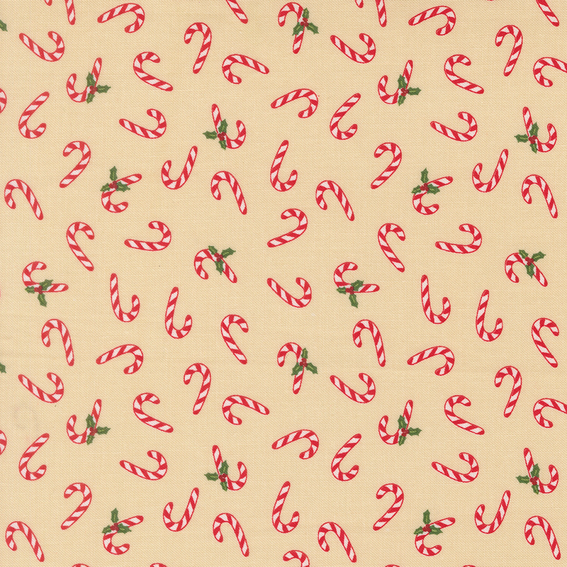 Red and white striped candy canes and holly tossed on a tan background.