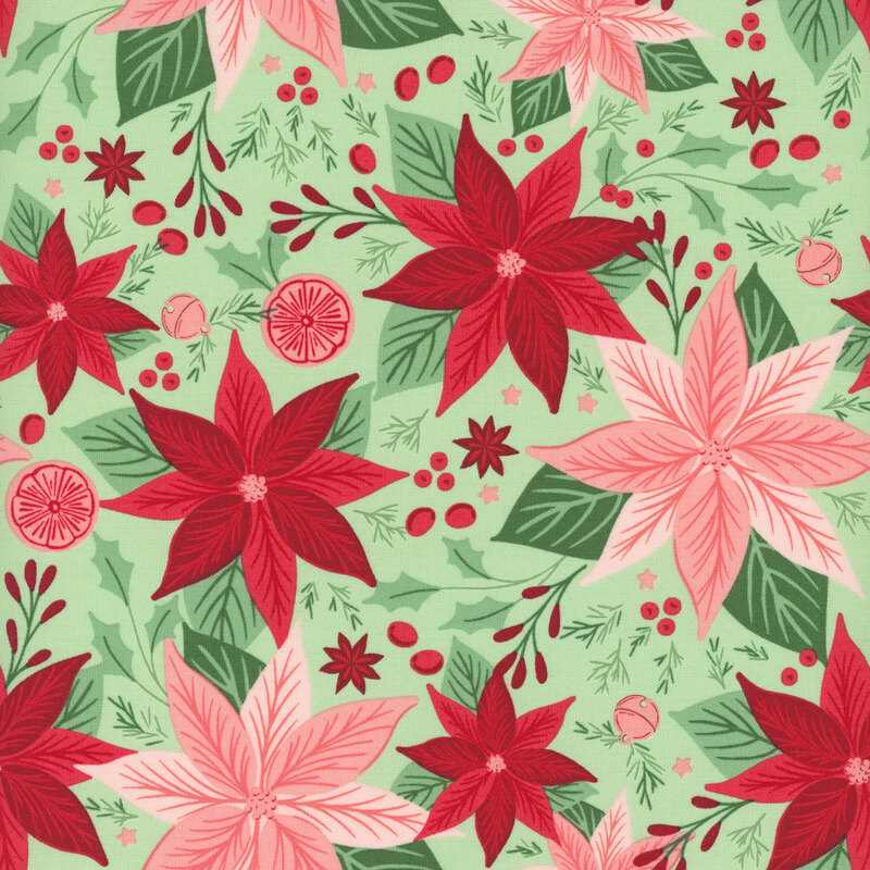 A pistachio green fabric with pink and red poinsettia flowers, holly leaves, orange slices, and sleigh bells