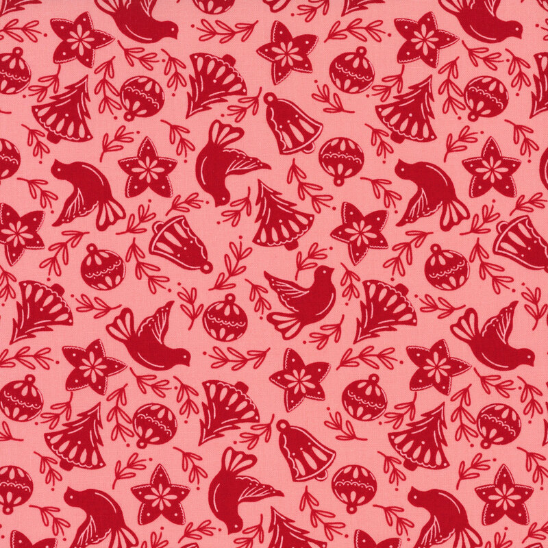 Salmon pink fabric with red Christmas trees, bells, leaves, stars, ornaments, and doves