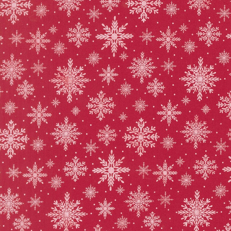 Bright red fabric with a pattern of delicate snowflakes in various sizes