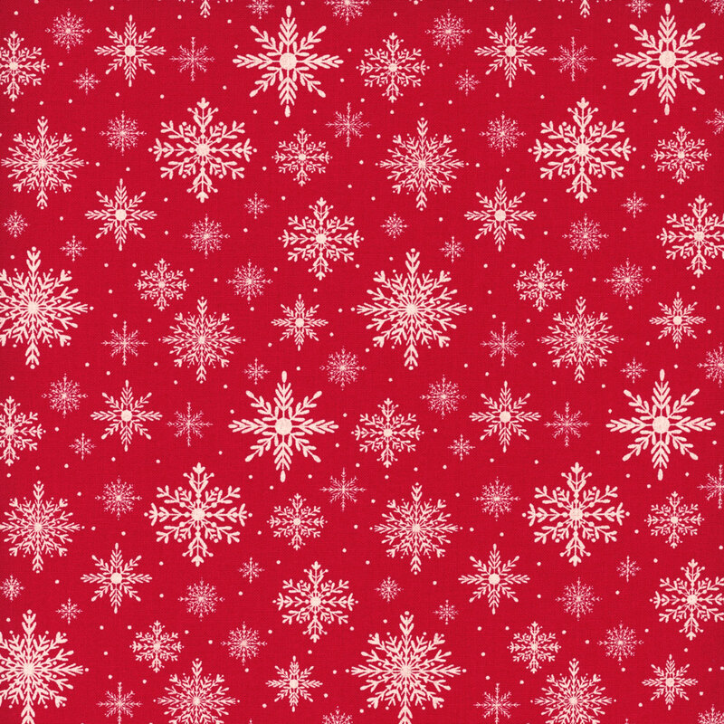 Bright red fabric with a pattern of delicate snowflakes in various sizes