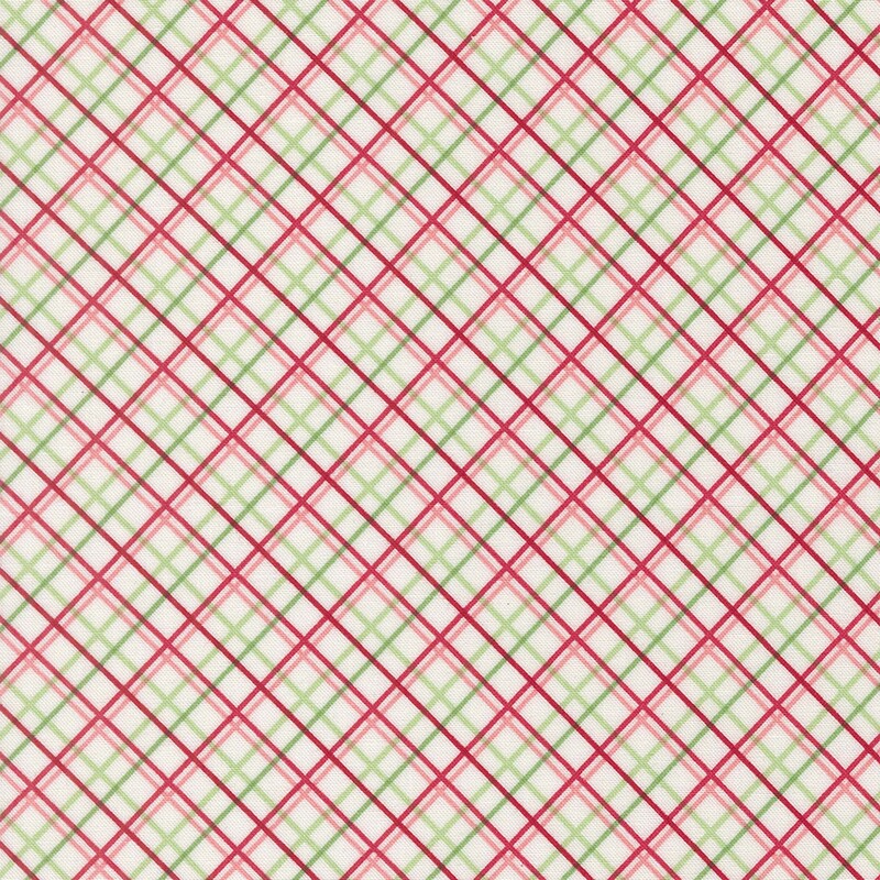 White fabric with a red, pink, and green diagonal windowpane plaid pattern