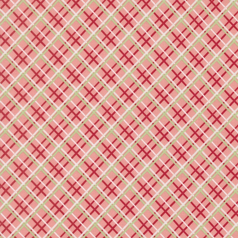 Salmon pink fabric with a red, white, and green diagonal windowpane plaid pattern