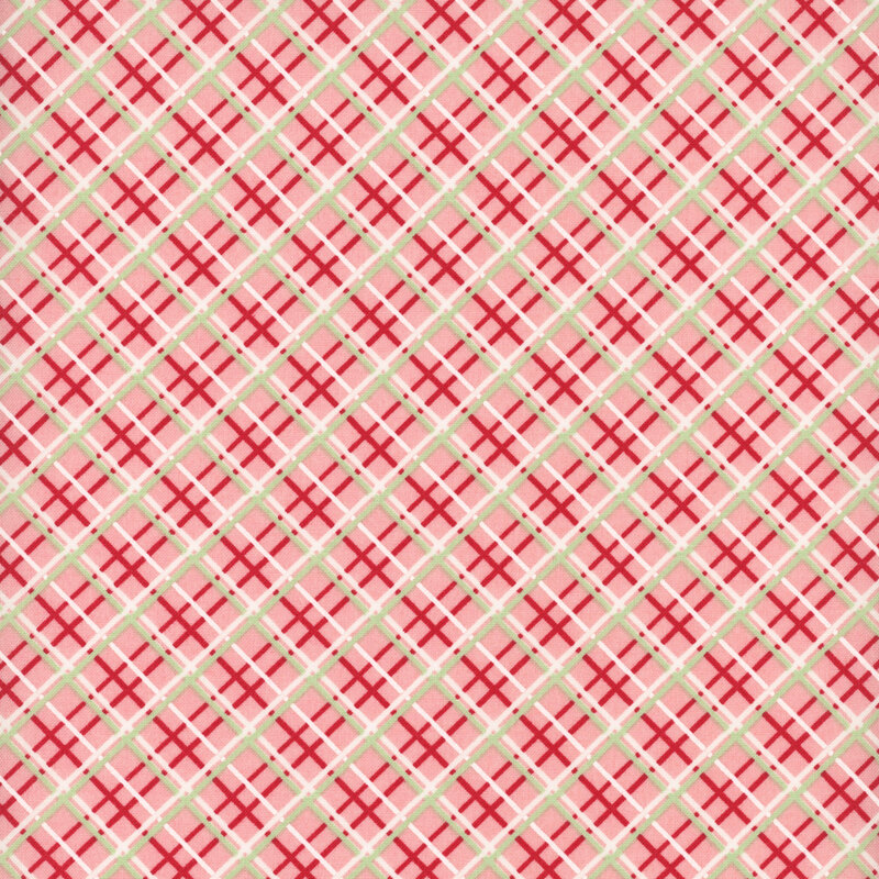 Salmon pink fabric with a red, white, and green diagonal windowpane plaid pattern
