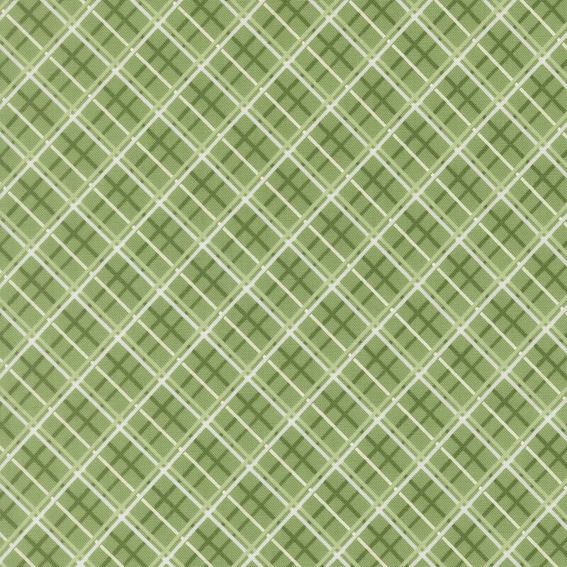 Medium green fabric with a dark green, light green, and white diagonal windowpane plaid pattern