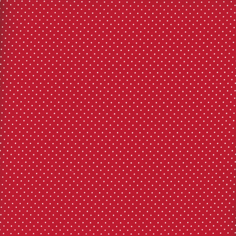 Cranberry red fabric with a delicate pattern of white pin dots