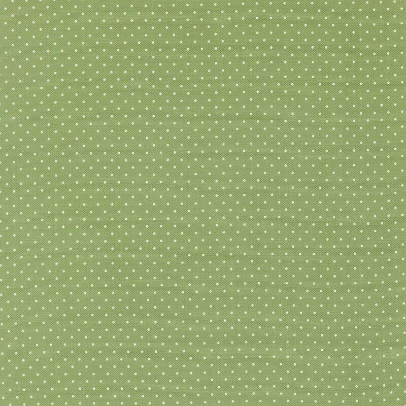 Pistachio fabric with a delicate pattern of white pin dots