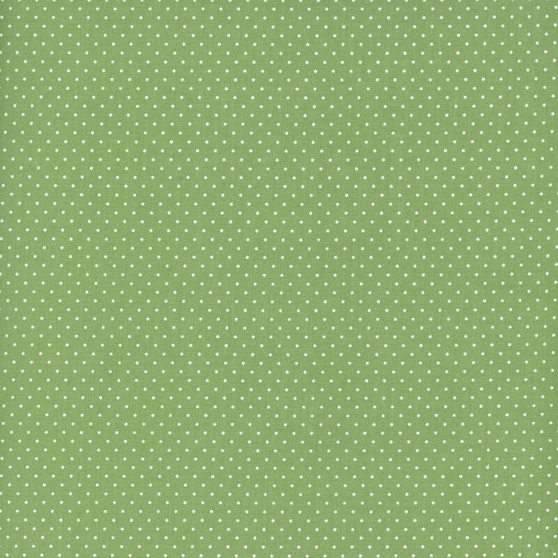 Pistachio fabric with a delicate pattern of white pin dots