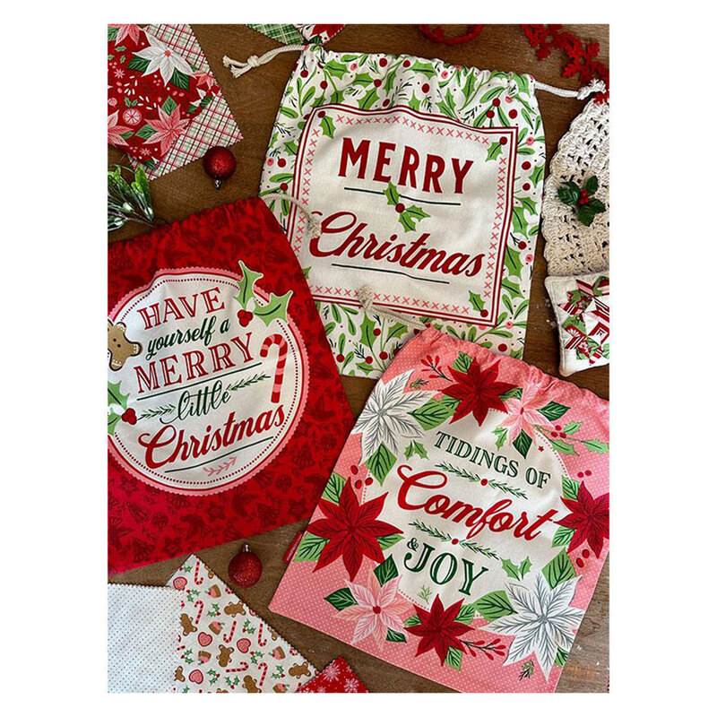 Image of the Gift bags, in green, red, and pink, with Christmas-y sayings and motifs 