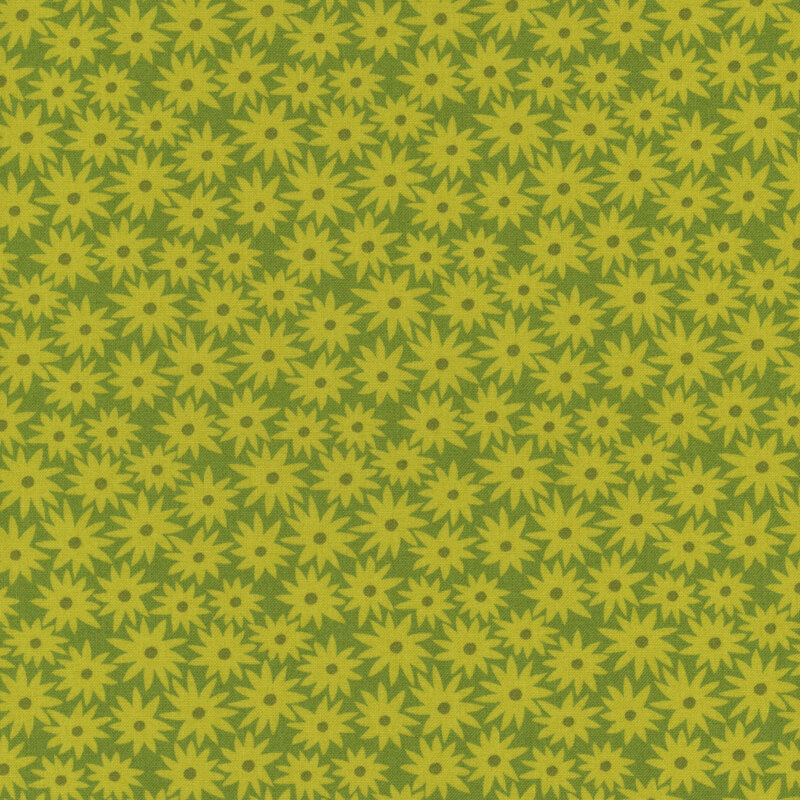 Grass green fabric with chartreuse daisies in a dense pattern