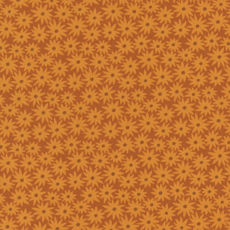 Cinnamon colored fabric with butterscotch daisies in a dense pattern