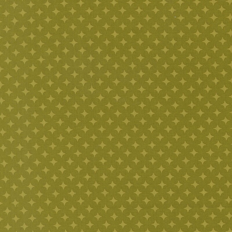 Olive green fabric with a geometric pattern of yellow-green diamonds 