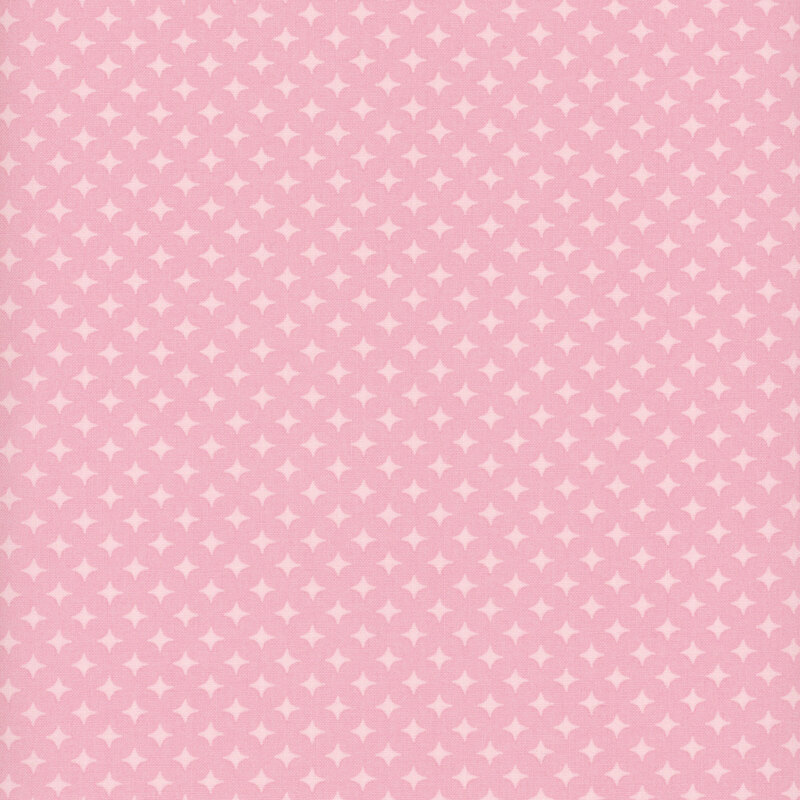 Ballet pink fabric with a geometric pattern of pastel pink diamonds 