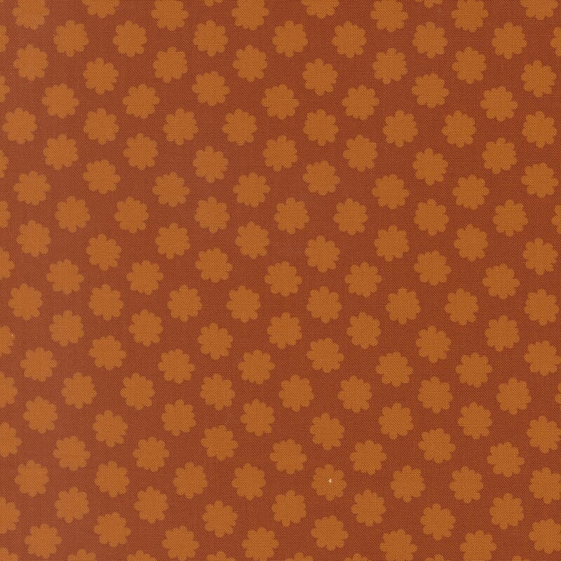 Burnt sienna fabric with pumpkin orange floral polka dots