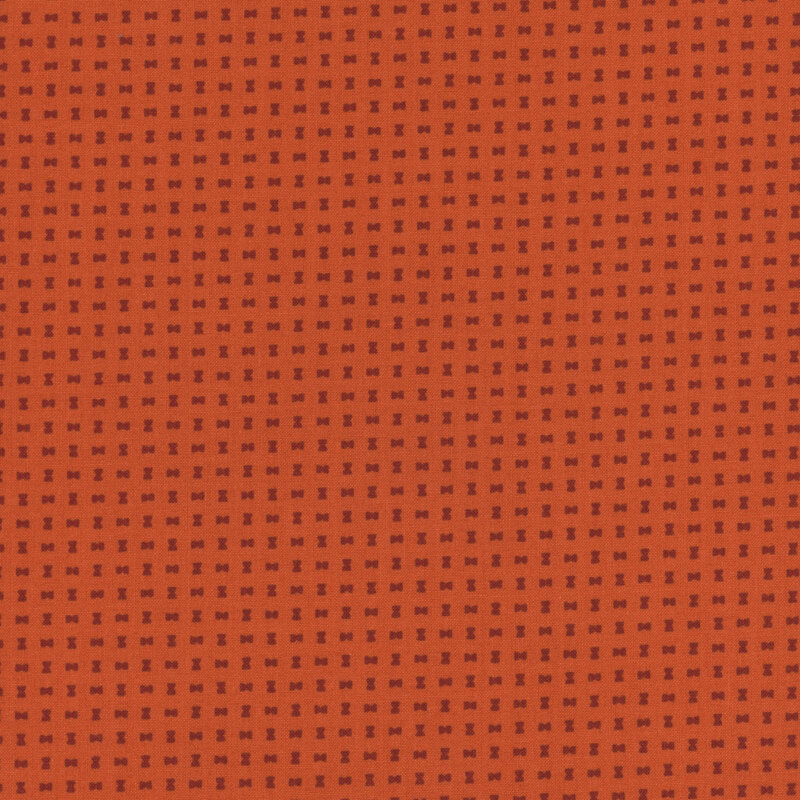 Small russet orange hourglass shapes on an auburn background