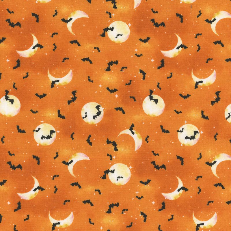 Bats, stars, and moons cover on mottled bright orange fabric.