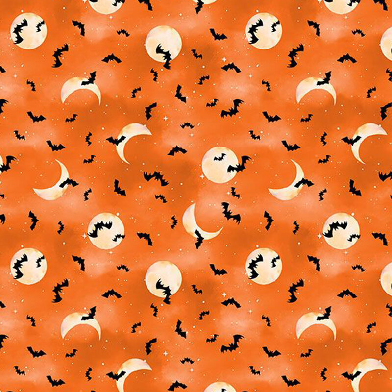 Bats, stars, and moons cover on mottled bright orange fabric.