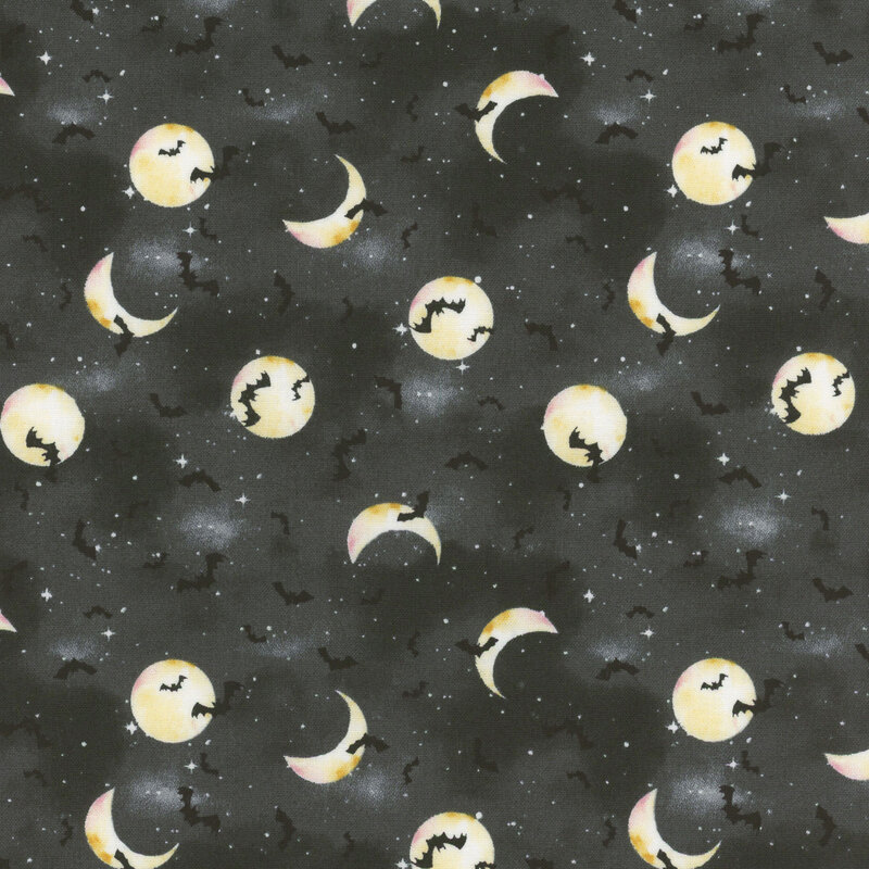 Bats, stars, and moons cover on mottled black fabric.