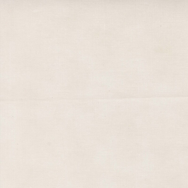 A light cream beige fabric with subtle mottling