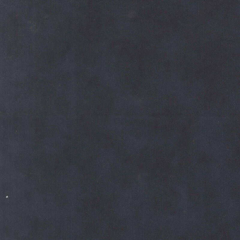 A mottled deep midnight blue fabric 