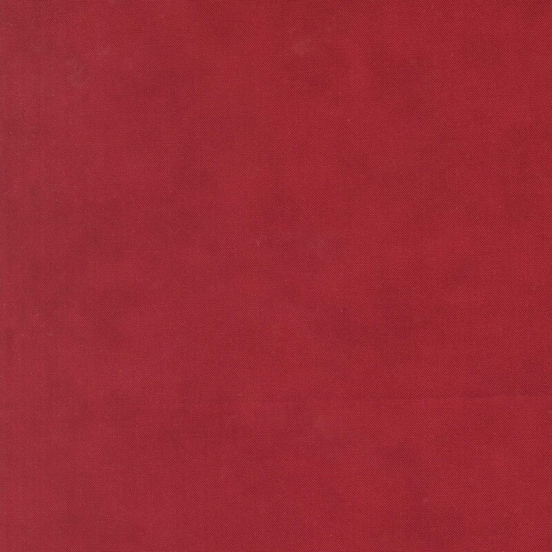 A mottled cranberry red fabric 