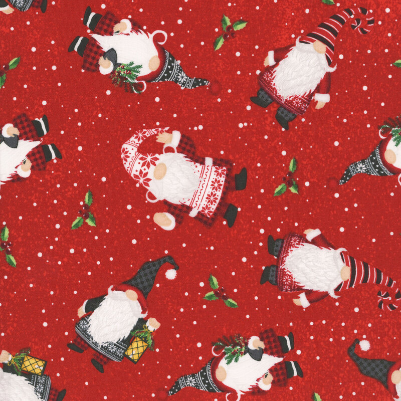 Red fabric tossed with festive gnomes, sprigs of holly and mistletoe on a background of snowy dots.