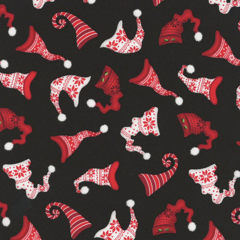 Festive stocking caps in red and white tossed on a textured black background.