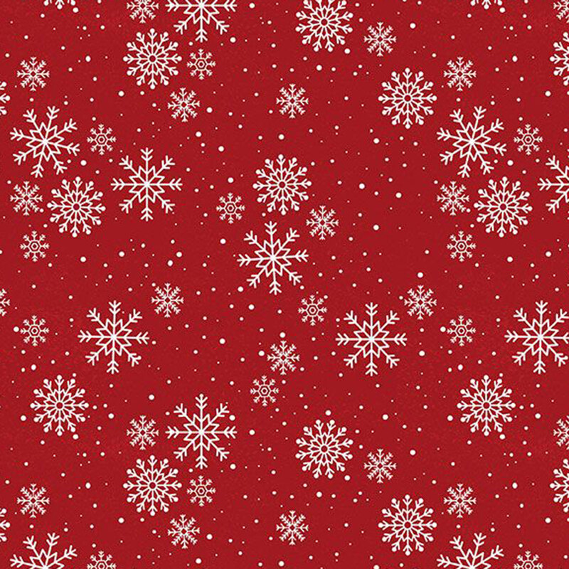 Delicate white snowflakes tossed on red fabric.