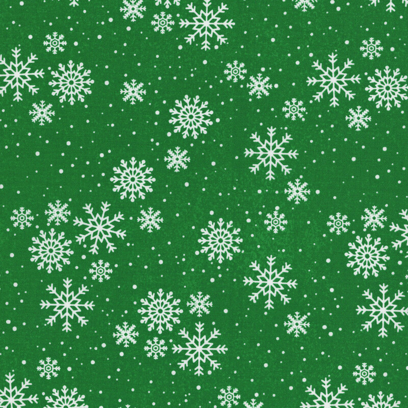 Delicate white snowflakes tossed on green fabric.