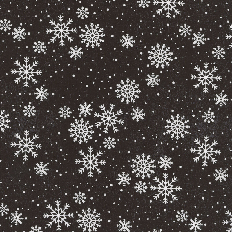 Delicate white snowflakes tossed on black fabric.