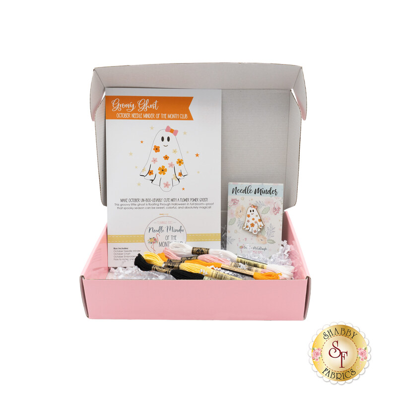 The October Needle Minder of the Month box, open and showing the contents, from the pattern to the floss and needle minder.