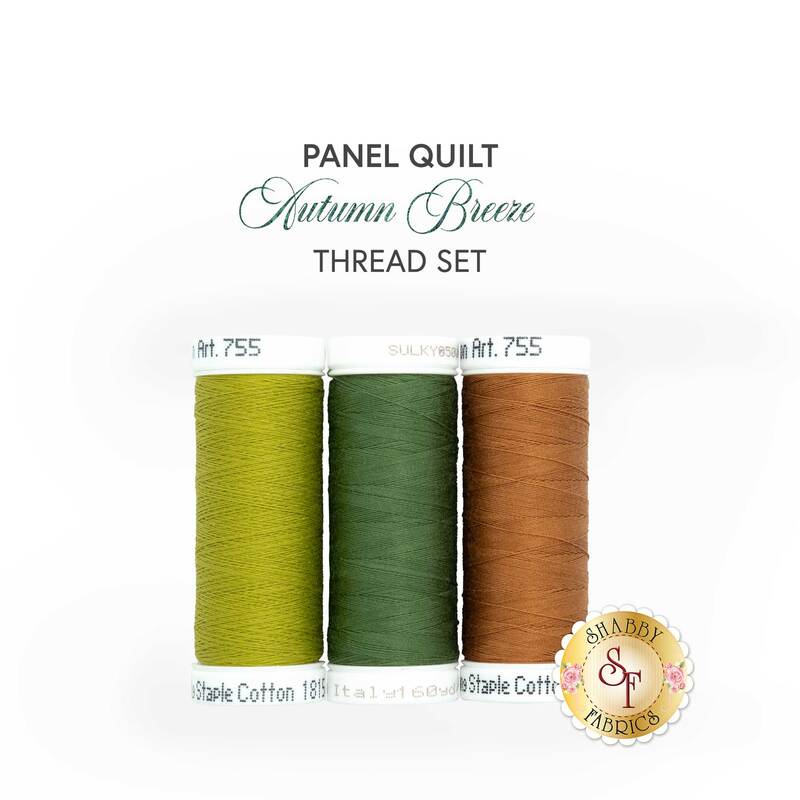 The thread set for the Autumn Breeze Panel Quilt, four spools of yellow, green, blue, and sienna thread, isolated on a white background.