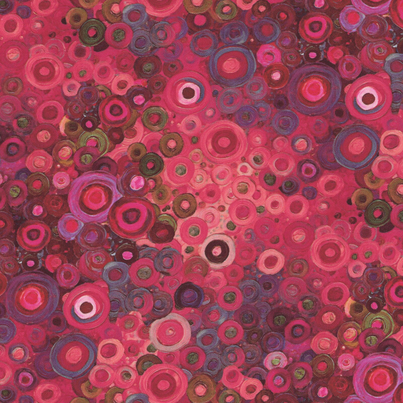 Overlapping multi-colored rings in various hues of pink and purple.