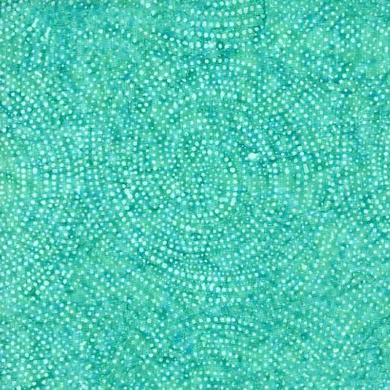 A mottled aquamarine and green fabric with swirls of dots 