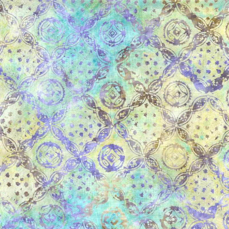Watercolor citrine and turquoise fabric with a diagonal ornamental pattern of crossed lines with circles in the middle