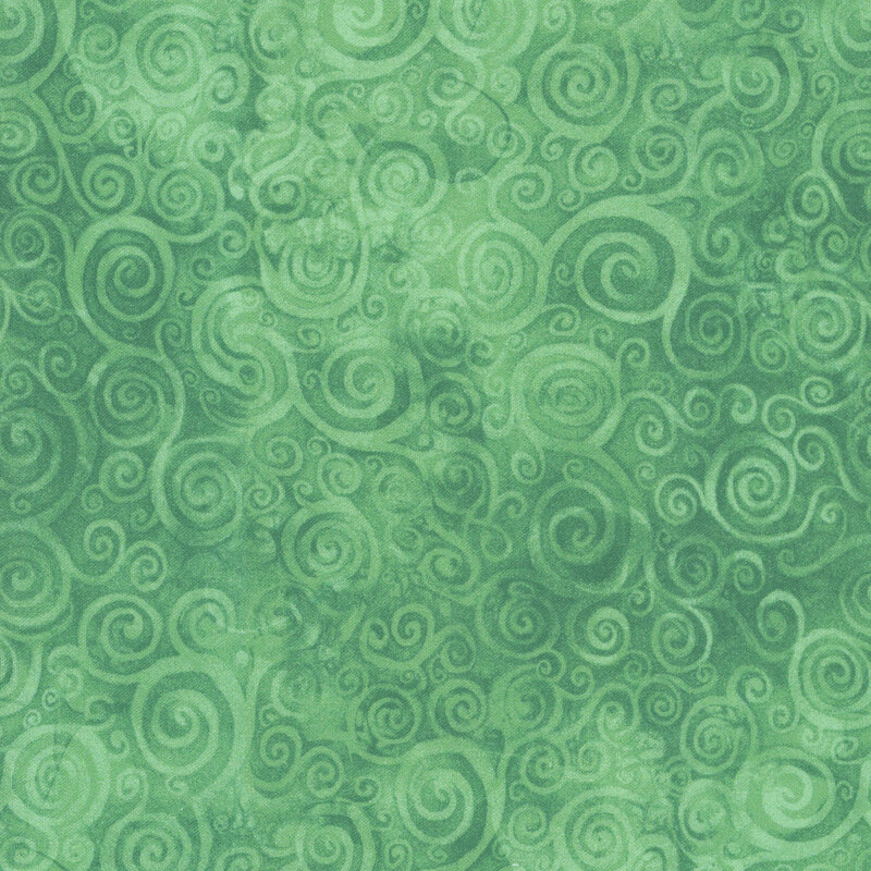 A mottled green fabric with swirls. 